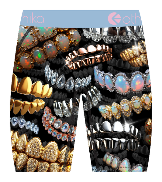 Boxer briefs with gemstone and jewelry design on a black background, featuring the brand 'ethika'.