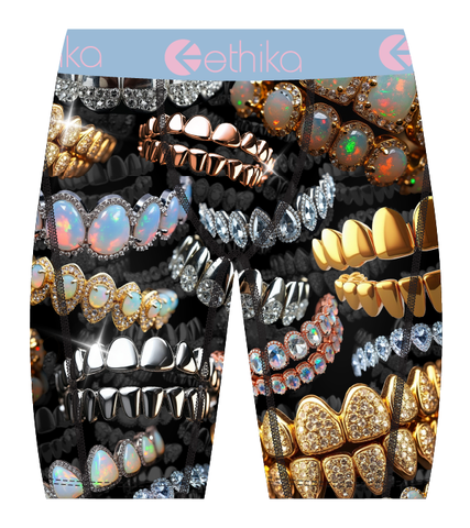Boxer briefs with gemstone and jewelry design on a black background, featuring the brand 'ethika'.