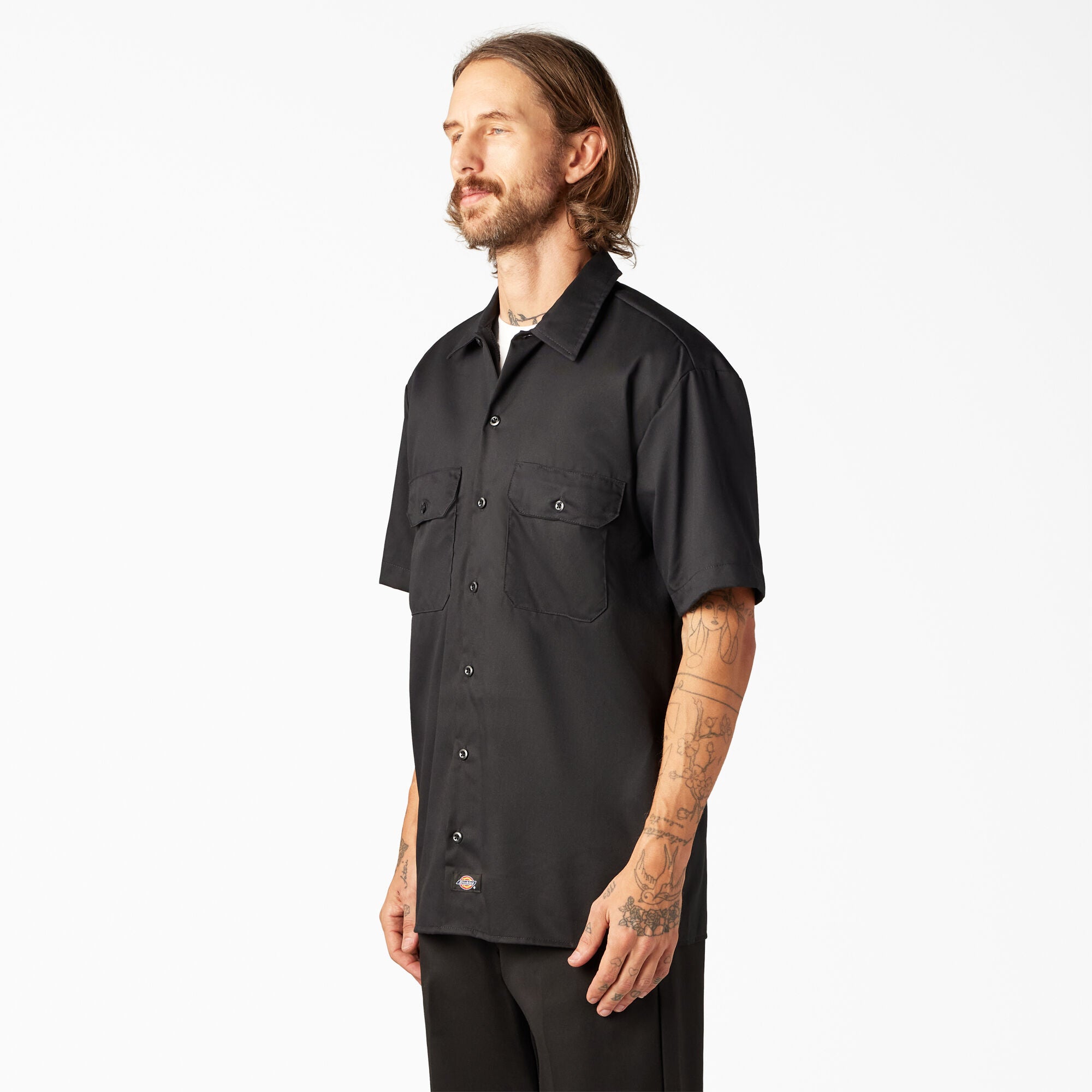 Man wearing a black short-sleeve Dickes top