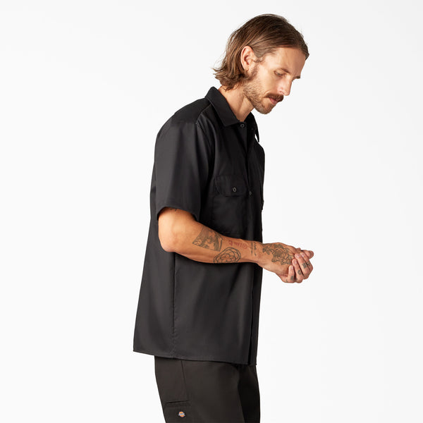 Man wearing a black short-sleeve Dickes top