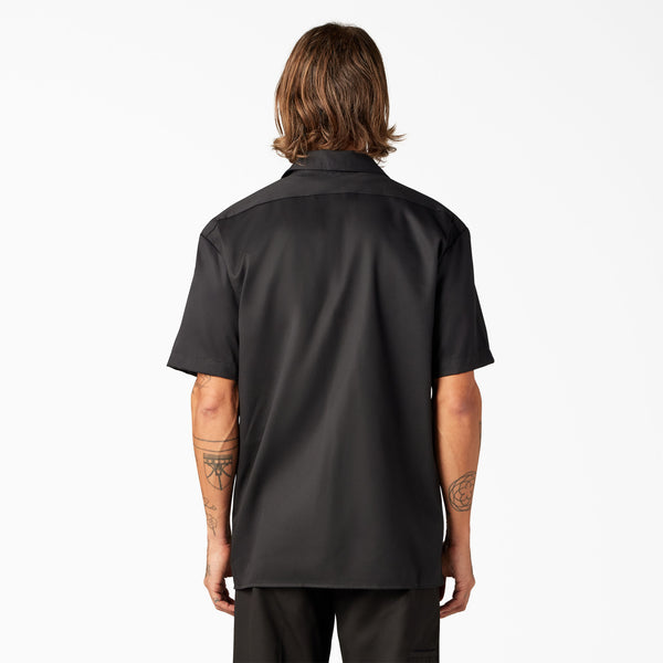 Man wearing a black short-sleeve Dickes top
