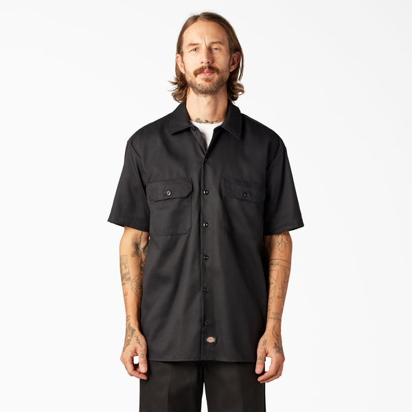 Man wearing a black short-sleeve Dickes top