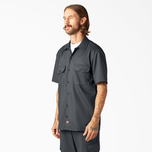 Man wearing a Dickies charcoal short-sleeve button-up shirt 