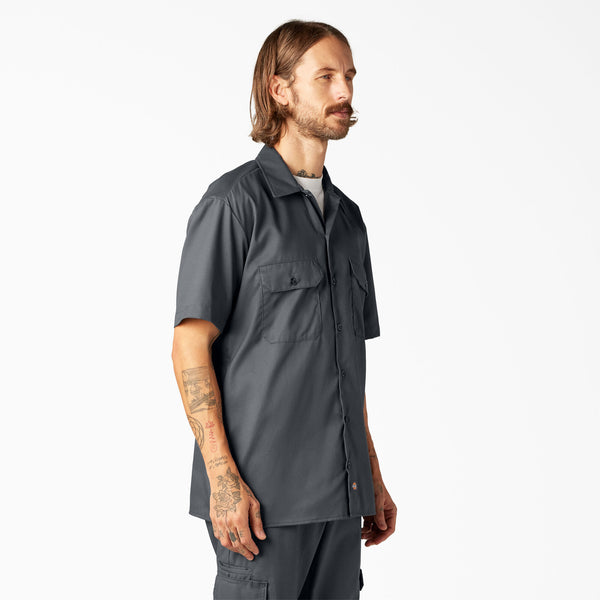 Man wearing a Dickies charcoal short-sleeve button-up shirt 