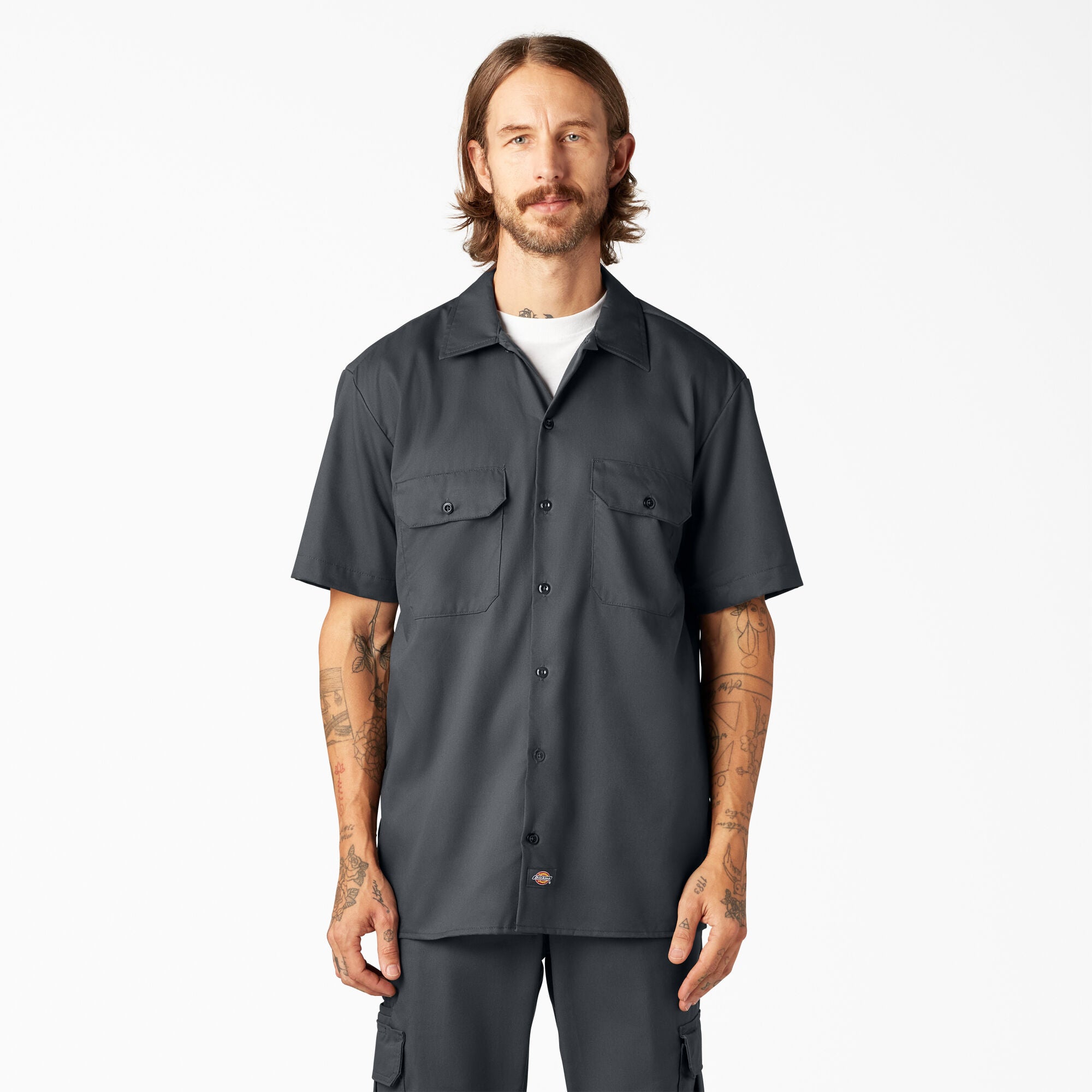 Man wearing a Dickies charcoal short-sleeve button-up shirt 