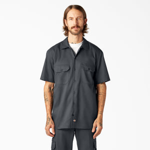Man wearing a Dickies charcoal short-sleeve button-up shirt 