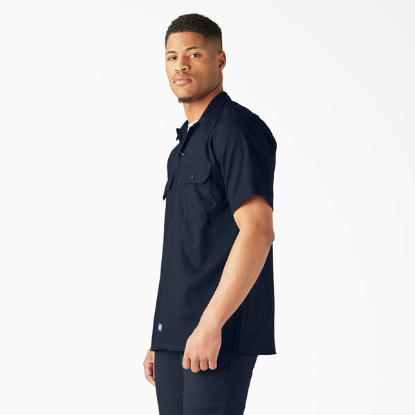 Man wearing a Dickies dark navy short-sleeve button-up shirt 