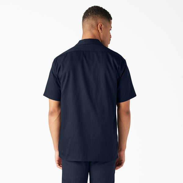 Man wearing a Dickies dark navy short-sleeve button-up shirt 