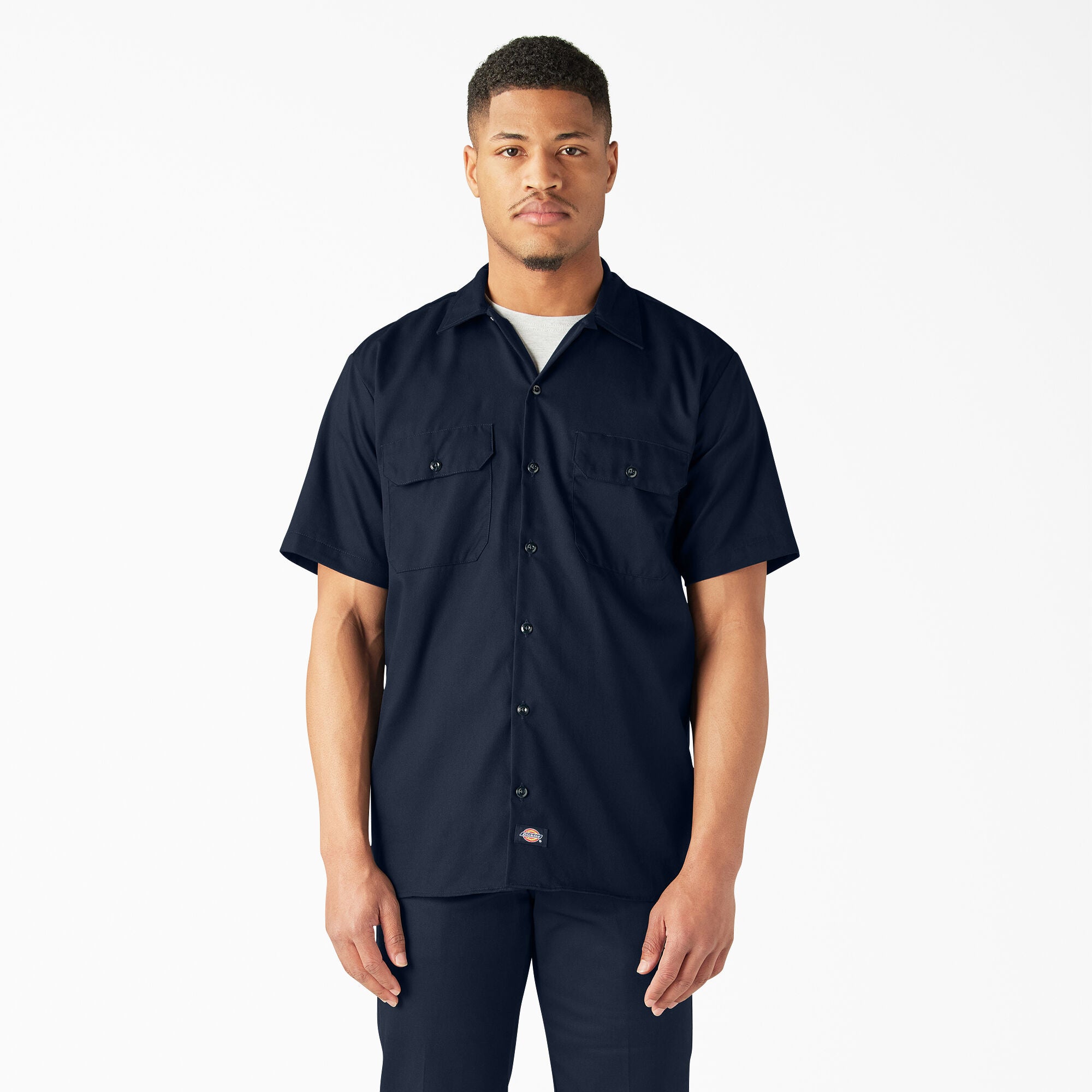 Man wearing a Dickies dark navy short-sleeve button-up shirt 