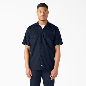 Man wearing a Dickies dark navy short-sleeve button-up shirt 