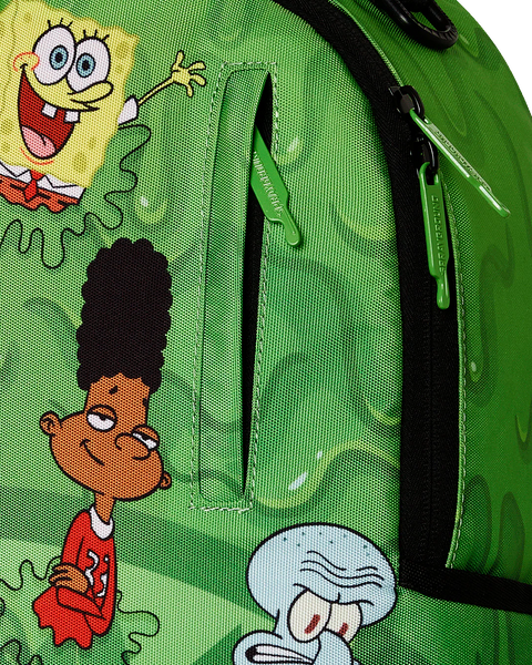 Sprayground 90s Nickelodeon Slime Drip backpack with cartoon character designs on a green background