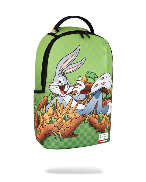 Sprayground Backpack with cartoon character design on a green background